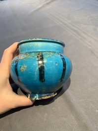 A fine Raqqa turquoise-glazed striped jar, Syria, 13th C.