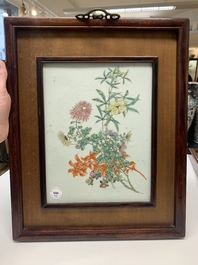 A pair of Chinese famille rose plaques in wooden frames, 20th C.