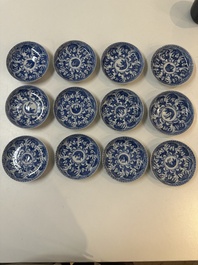 11 Japanese blue and white cups and 12 saucers with floral design, Chenghua mark, Meiji, 19th C.