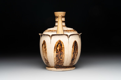 An Annamese or Vietnamese brown-glazed cream-ground 'lotus' ewer, 14th C.