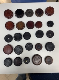 A large collection of 87 Chinese wooden stands, 19/20th C.