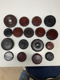 A large collection of 87 Chinese wooden stands, 19/20th C.