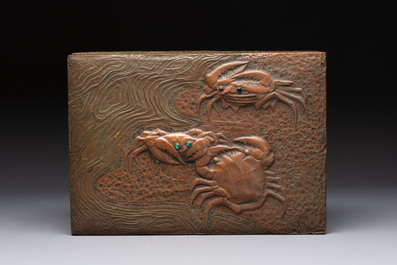 Alfred Daguet (Paris, 1875-1942): An Art Nouveau repouss&eacute; brass- and copper-mounted box with 'crabs' design and inset glass eyes, ca. 1900