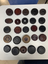 A large collection of 87 Chinese wooden stands, 19/20th C.