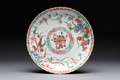 A Dutch-decorated Chinese plate, an Imari-verte dish and a blue and white dish, Kangxi/Yongzheng