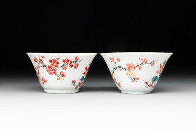 Two Chinese famille rose 'birds on flowering branches' cups and saucers, Yongzheng