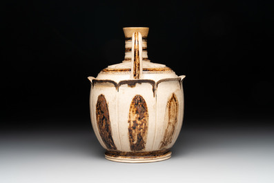 An Annamese or Vietnamese brown-glazed cream-ground 'lotus' ewer, 14th C.