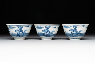A set of 11 Chinese blue and white 'rabbit hunt' cups and saucers, Qianlong mark, 19th C.