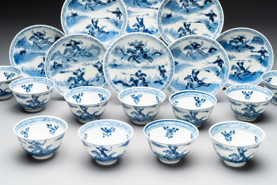 A set of 11 Chinese blue and white 'rabbit hunt' cups and saucers, Qianlong mark, 19th C.