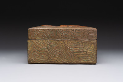 Alfred Daguet (Paris, 1875-1942): An Art Nouveau repouss&eacute; brass- and copper-mounted box with 'crabs' design and inset glass eyes, ca. 1900