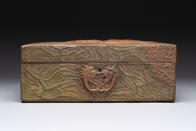 Alfred Daguet (Paris, 1875-1942): An Art Nouveau repouss&eacute; brass- and copper-mounted box with 'crabs' design and inset glass eyes, ca. 1900