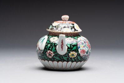A Chinese famille rose teapot and stand, and a famille rose black-ground teapot, Yongzheng/Qianlong