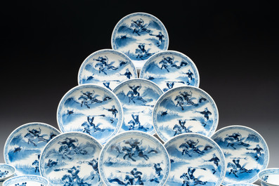 A set of 11 Chinese blue and white 'rabbit hunt' cups and saucers, Qianlong mark, 19th C.