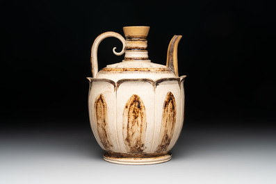 An Annamese or Vietnamese brown-glazed cream-ground 'lotus' ewer, 14th C.