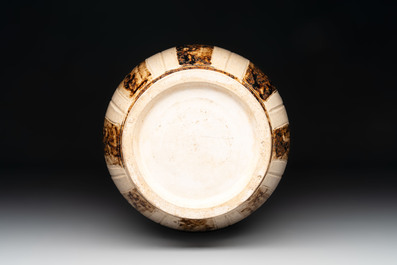 An Annamese or Vietnamese brown-glazed cream-ground 'lotus' ewer, 14th C.