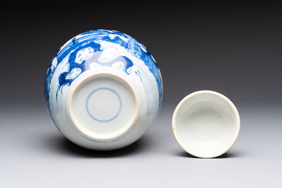 A pair of Chinese polychrome-decorated blue and white plates and a blue and white covered jar, Qianlong mark, 19th C.