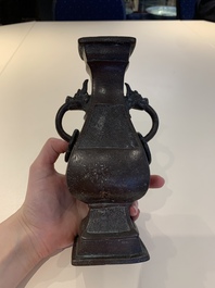 A Chinese archaistic bronze vase and three Japanese bronze vases, 14/18th C.
