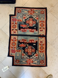 Two Tibetan saddle rugs and three small rugs, 19th C.