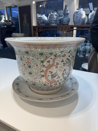 A pair of large Chinese famille rose 'dragon and phoenix' jardini&egrave;res and stands, 20th C.
