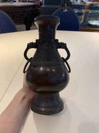 A Chinese archaistic bronze vase and three Japanese bronze vases, 14/18th C.