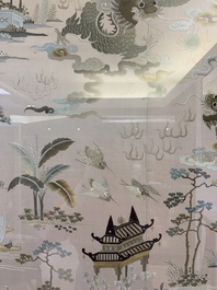 A very large Chinese beige-ground embroidered silk panel depicting scenes of Chinese rural life, 19th C.