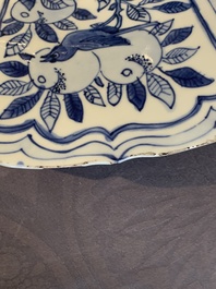 A large Chinese blue and white 'kraak' dish with birds among flowering branches, Wanli