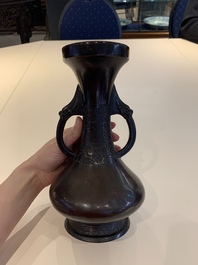 A Chinese archaistic bronze vase and three Japanese bronze vases, 14/18th C.