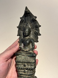 A Khmer bronze figure of Buddha Mucilinda, Angkor period, 12/13th C.