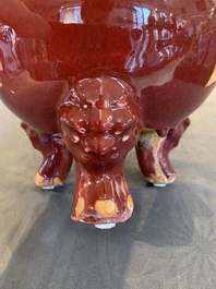 A Chinese flamb&eacute;-glazed tripod censer with 'ruyi' handles, 19th C.