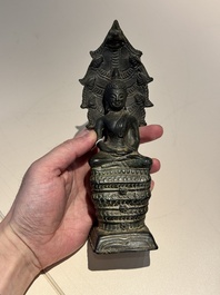 A Khmer bronze figure of Buddha Mucilinda, Angkor period, 12/13th C.