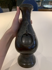 A Chinese archaistic bronze vase and three Japanese bronze vases, 14/18th C.