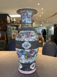 A pair of Chinese Nanking famille rose vases with narrative design, 19th C.