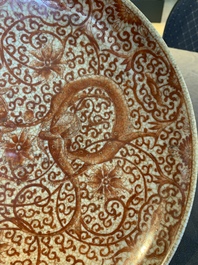 A Chinese iron-red-decorated crackle-glazed  'chilong and lotus scroll' plate, Jiajing mark, 19th C.