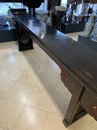 A massive Chinese red-and-black-lacquered altar table, 'qiaotouan', Qing