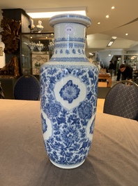 A Chinese blue and white 'flower scrolls' rouleau vase, Kangxi