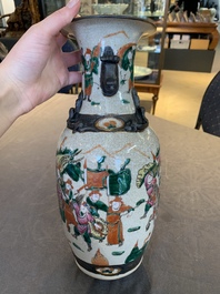 Seven Chinese Nanking blue and white and famille verte crackle-glazed vases, 19/20th C.