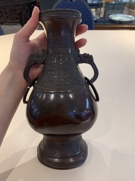 A Chinese archaistic bronze vase and three Japanese bronze vases, 14/18th C.