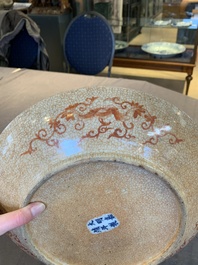 A Chinese iron-red-decorated crackle-glazed  'chilong and lotus scroll' plate, Jiajing mark, 19th C.