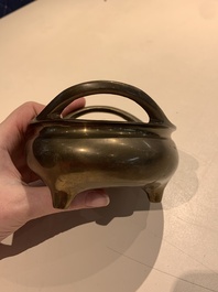A Chinese bronze tripod censer with two handles, Xuande mark, 19th C.