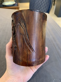 Two Chinese carved bamboo brush pots and an ink stone with wooden cover and stand, signed He Xuanting 何選廷 and Dian Liangbi 典良弼, 19th C.