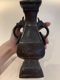 A Chinese archaistic bronze vase and three Japanese bronze vases, 14/18th C.