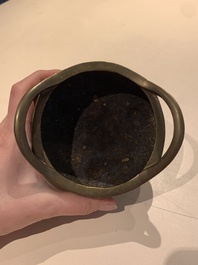 A Chinese bronze tripod censer with two handles, Xuande mark, 19th C.