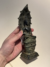 A Khmer bronze figure of Buddha Mucilinda, Angkor period, 12/13th C.