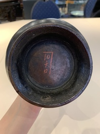 A Chinese archaistic bronze vase and three Japanese bronze vases, 14/18th C.