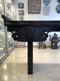 A massive Chinese red-and-black-lacquered altar table, 'qiaotouan', Qing