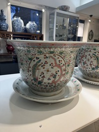 A pair of large Chinese famille rose 'dragon and phoenix' jardini&egrave;res and stands, 20th C.