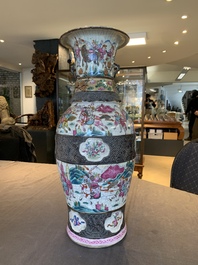 A pair of Chinese Nanking famille rose vases with narrative design, 19th C.