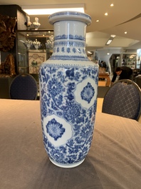 A Chinese blue and white 'flower scrolls' rouleau vase, Kangxi