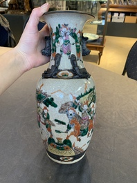 Seven Chinese Nanking blue and white and famille verte crackle-glazed vases, 19/20th C.