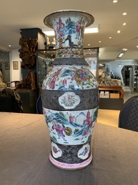 A pair of Chinese Nanking famille rose vases with narrative design, 19th C.